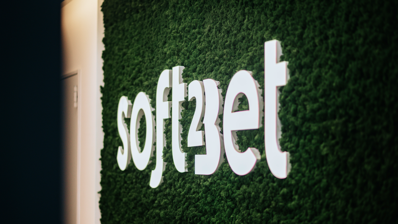 Soft 2 Bet Logo on Green Surface